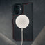 MagSafe charger on the Black with Red Detail Leather Case for iPhone 16