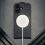 MagSafe charger attached to the Black with Red Stitching Leather Flip Case for iPhone 17
